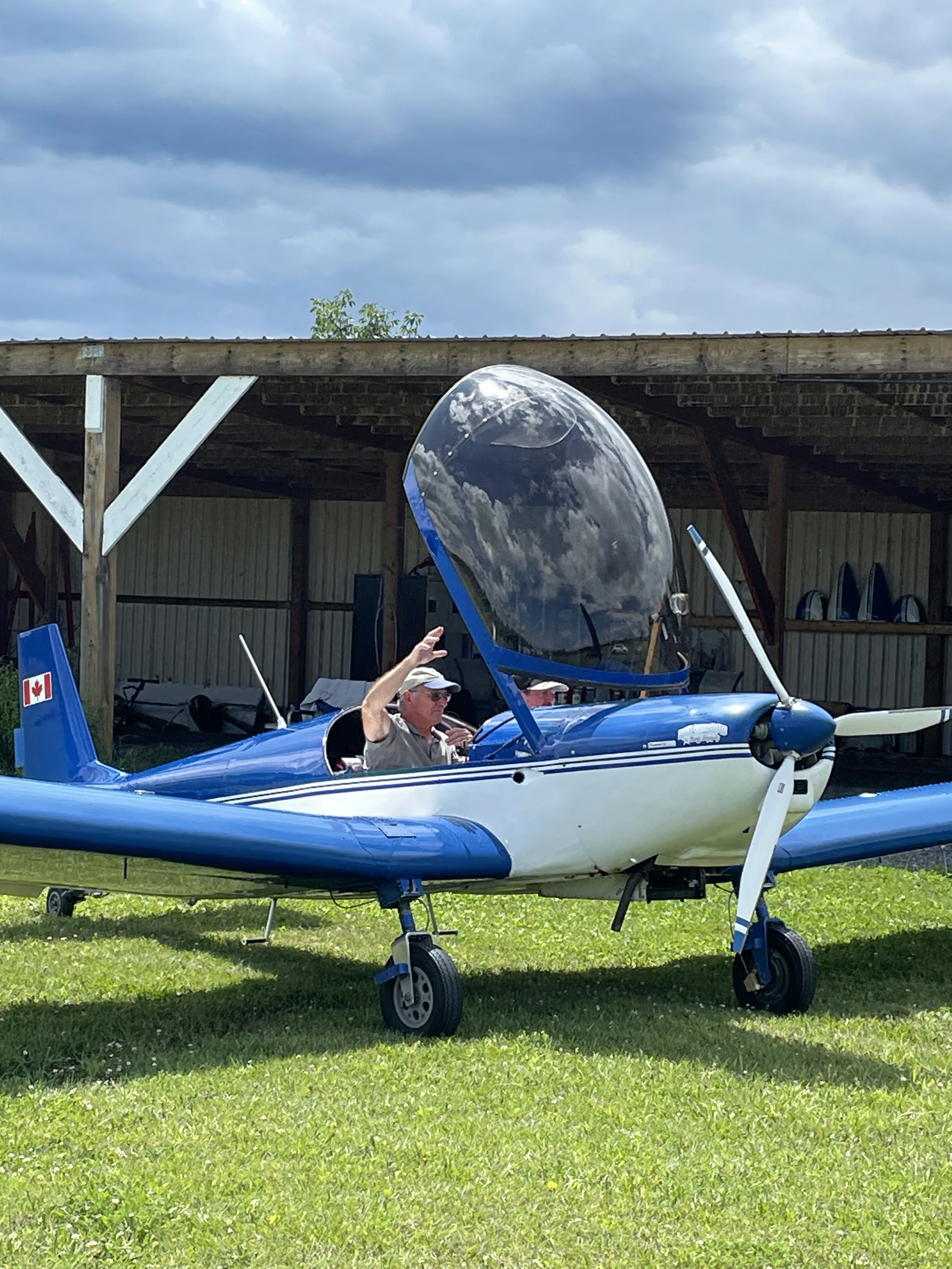 Blue and white Zenair with its canopy open